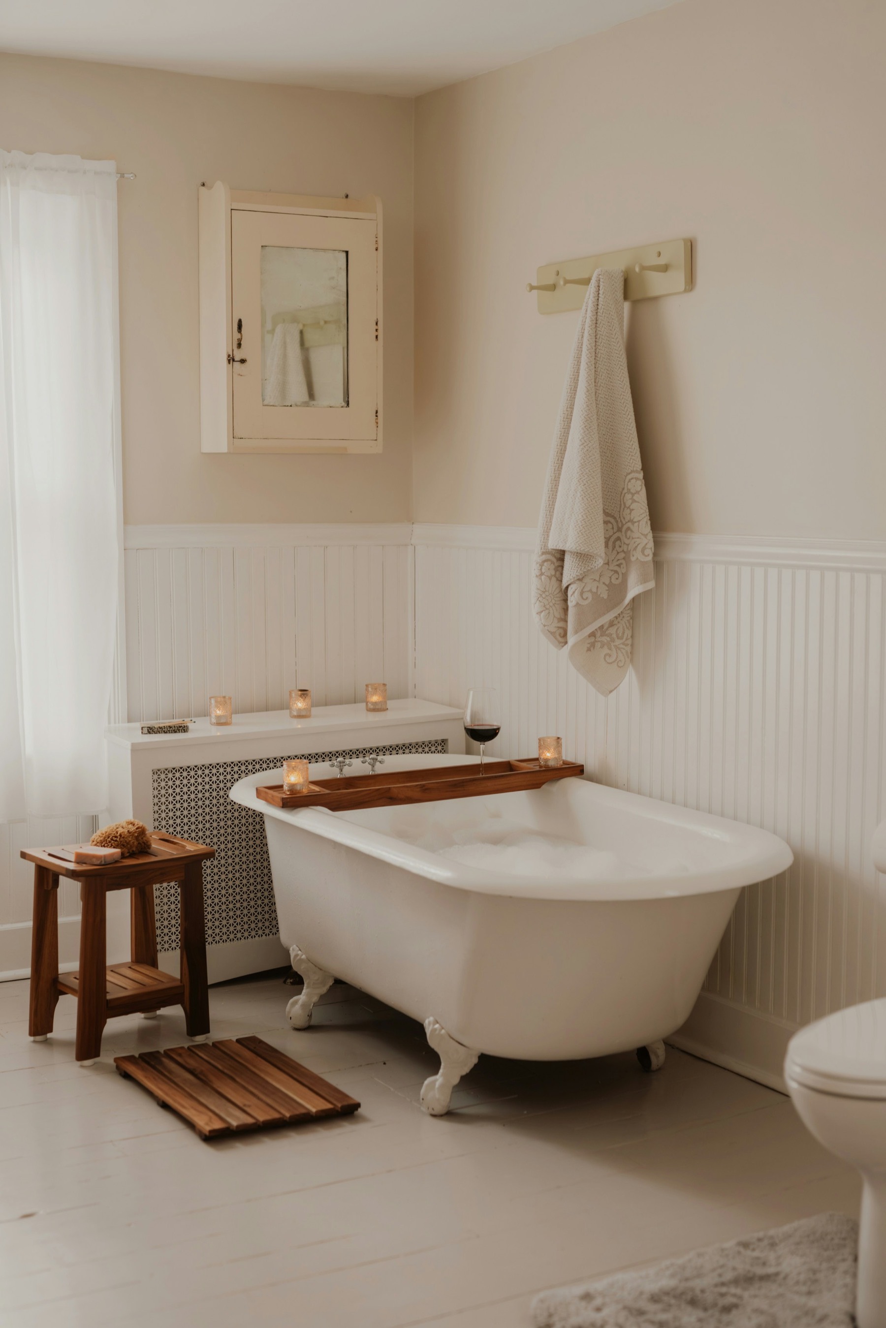 A serene bathroom prepared with candles